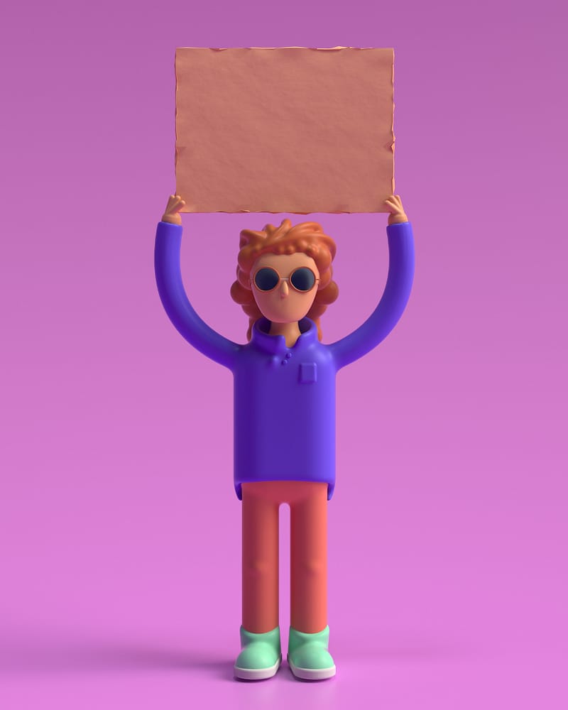 3D figurine holding a sign